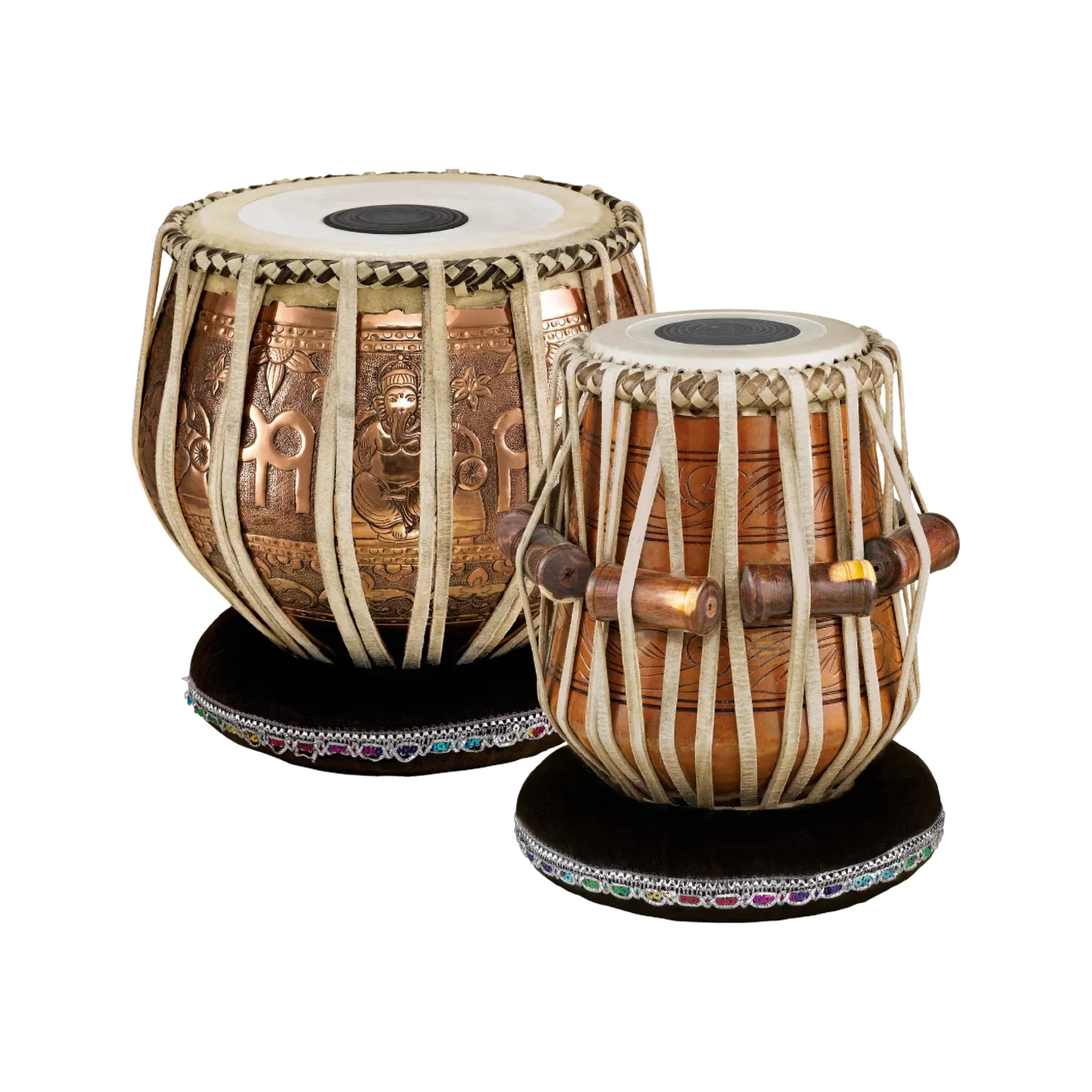 Ornate copper tabla drums with embossed Ganesha designs